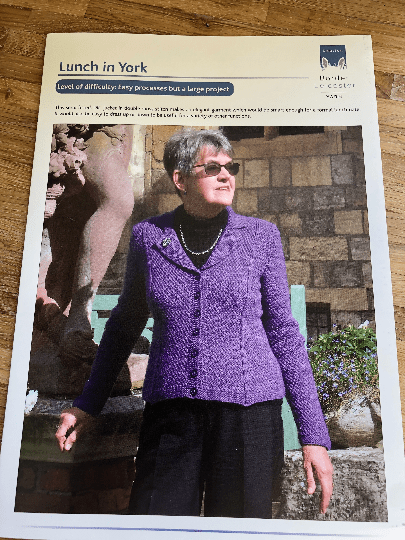 Woman wearing woolen jacket knitting kit made from border leicester yarn